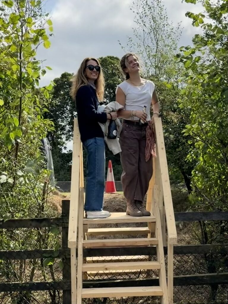 Wife and Daughter Standing On Their Bridge